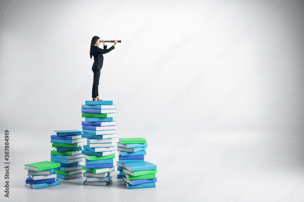 Young businesswoman with telescope on books ladder.