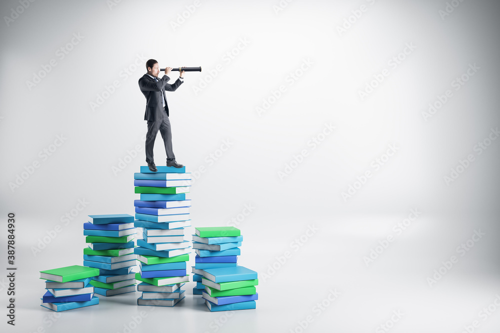 Businessman with telescope on creative books ladder.