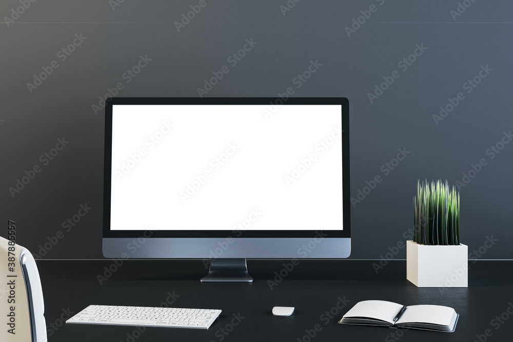 Contemporary business desk with blank computer screen