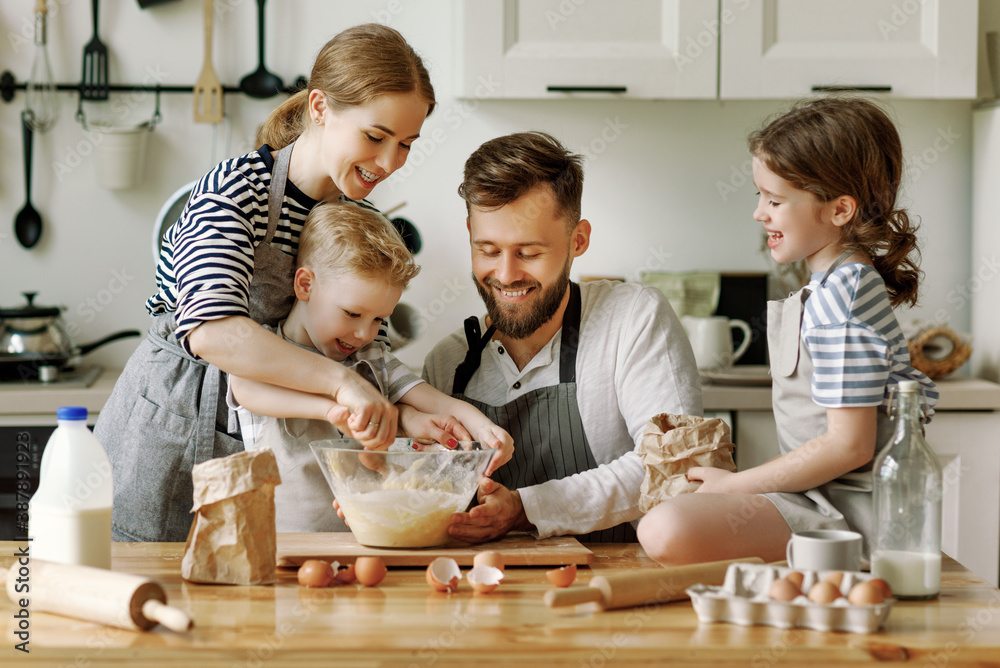 Positive family preparing pastry together