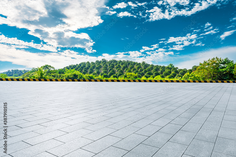 Empty square floor and green tea plantations with mountain natural scenery in Hangzhou on a sunny da