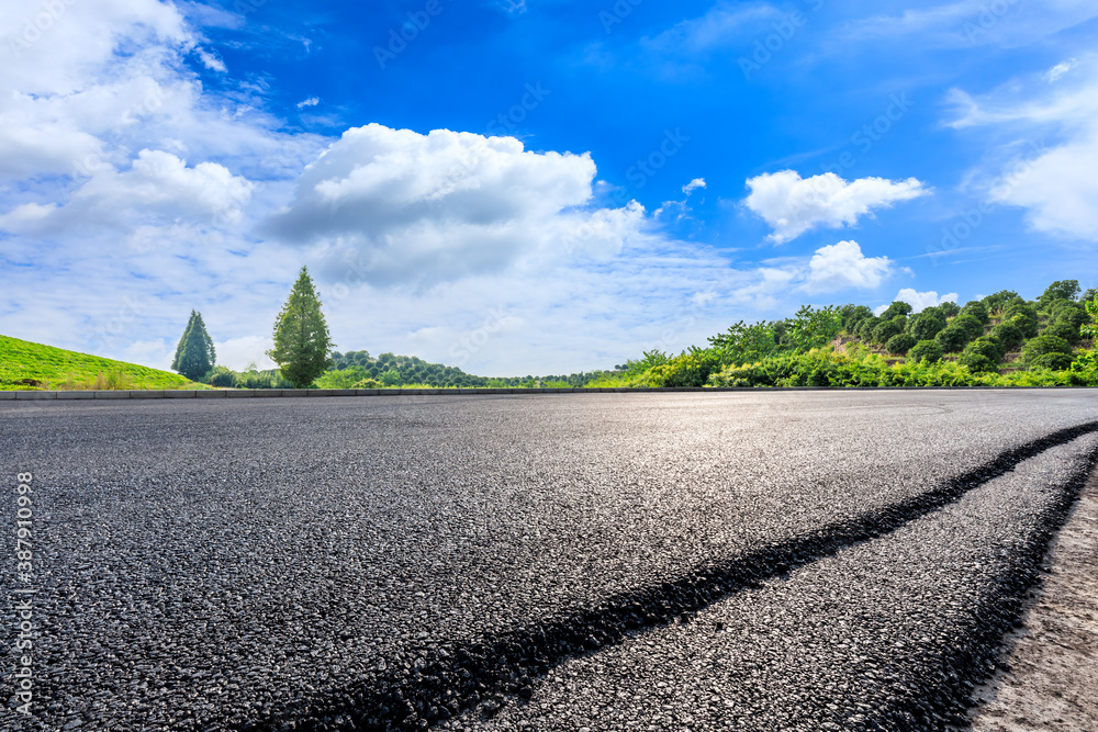 Countryside asphalt road and green tea plantations with mountain natural scenery in Hangzhou on a su