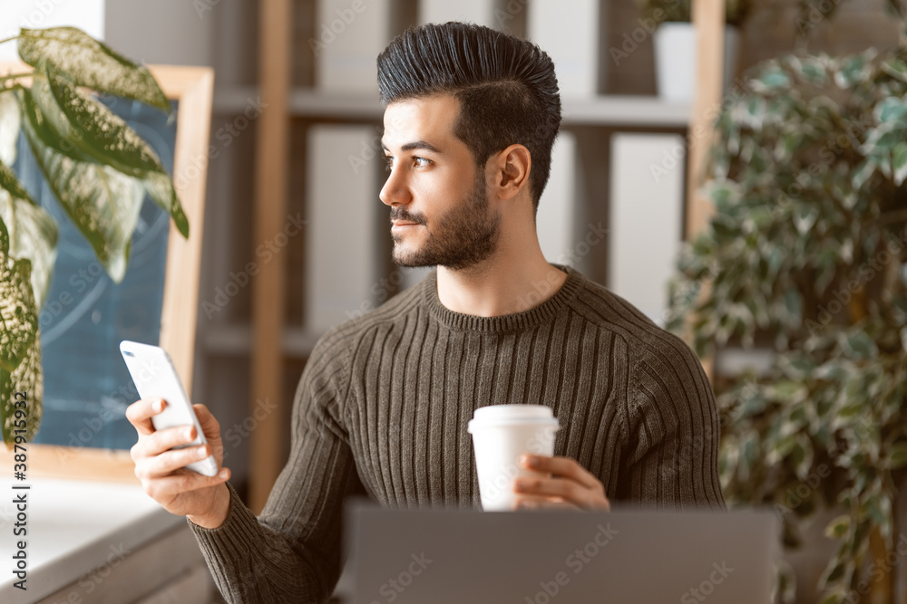 man working on a laptop at home