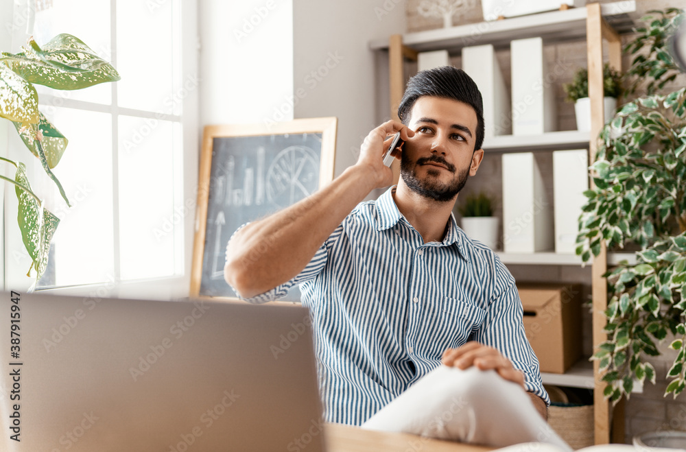 man working on a laptop at home