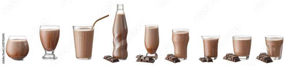 Set of glassware with tasty chocolate milk on white background