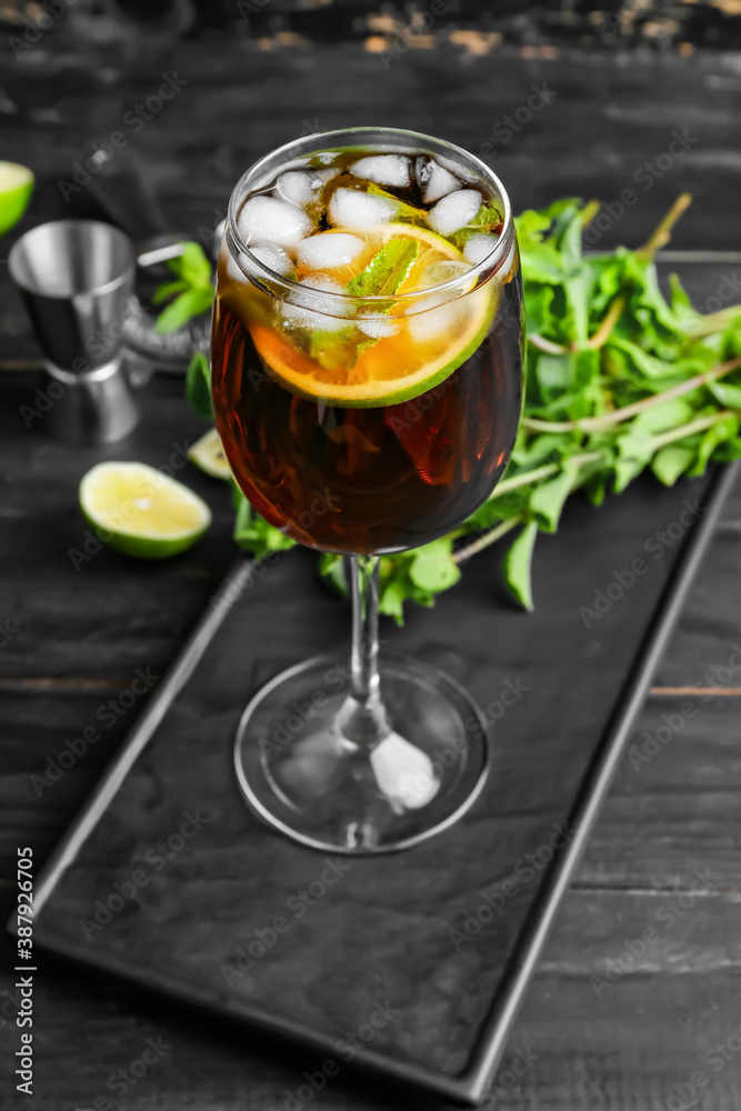 Glass of tasty Cuba Libre cocktail on table