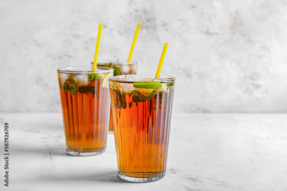 Glasses of tasty Cuba Libre cocktail on table