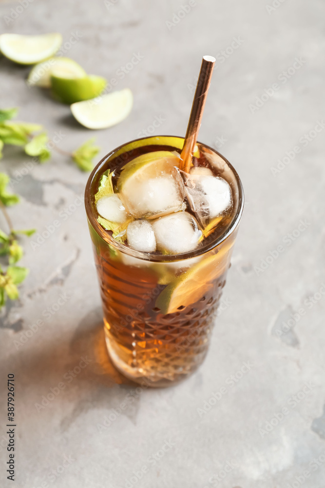 Glass of tasty Cuba Libre cocktail on table