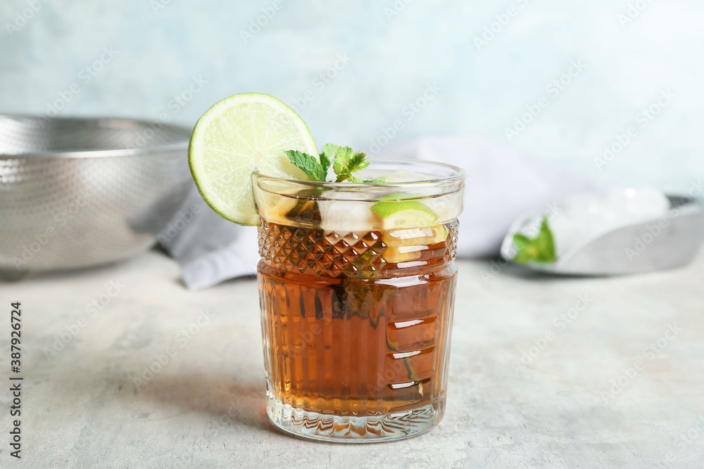 Glass of tasty Cuba Libre cocktail on table