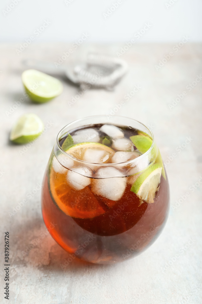 Glass of tasty Cuba Libre cocktail on table