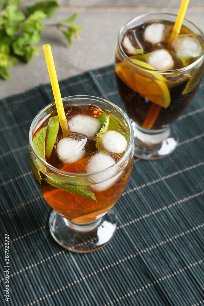 Glasses of tasty Cuba Libre cocktail on table