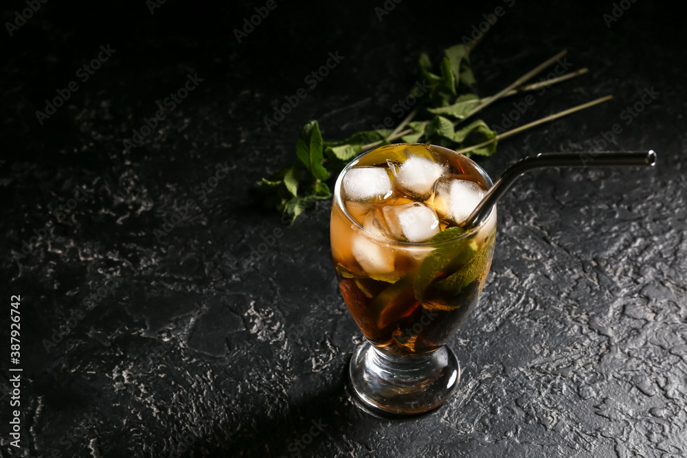 Glass of tasty Cuba Libre cocktail on table