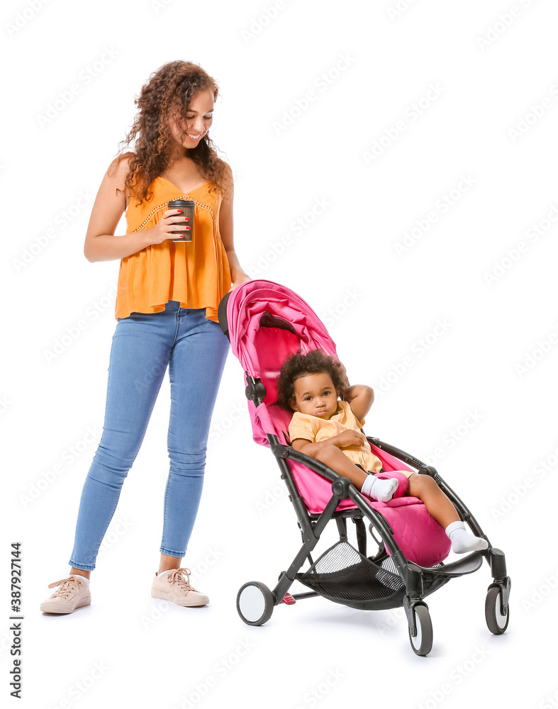 African-American woman and her cute baby in stroller on white background