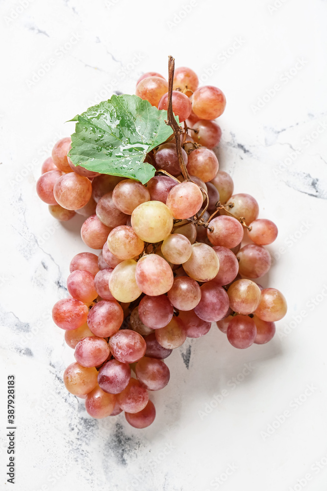 Sweet ripe grapes on light background