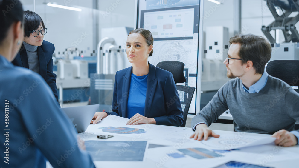 Modern Factory Office Meeting Room: Young Female Specialist Reports to Diverse Team of Engineers, Ma