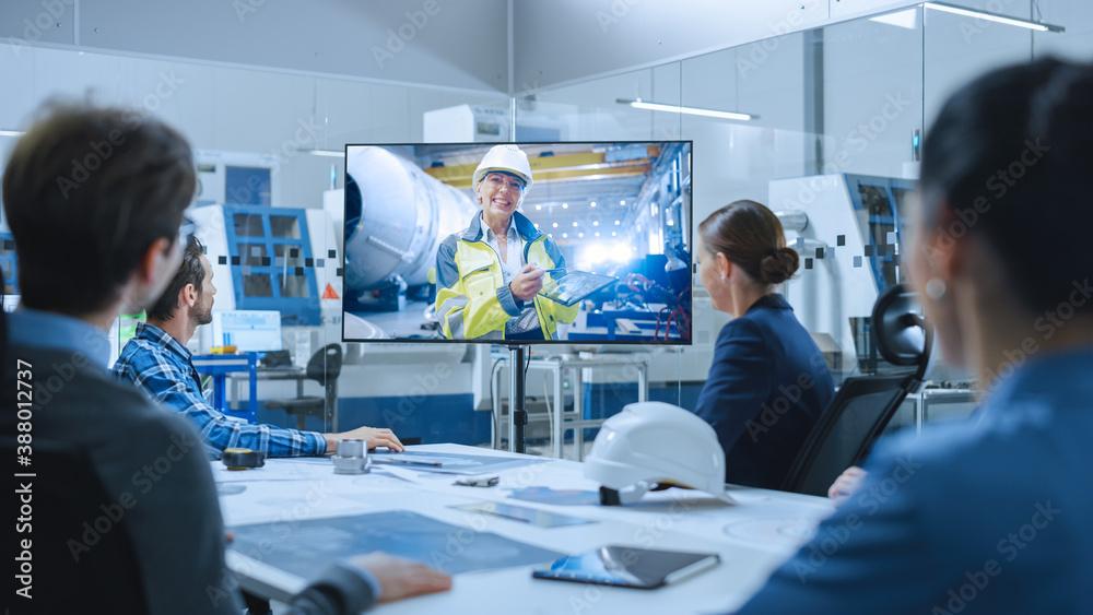 Diverse Group of Specialists, Managers in the Factory Office Meeting Room, Have Conference Video Cal