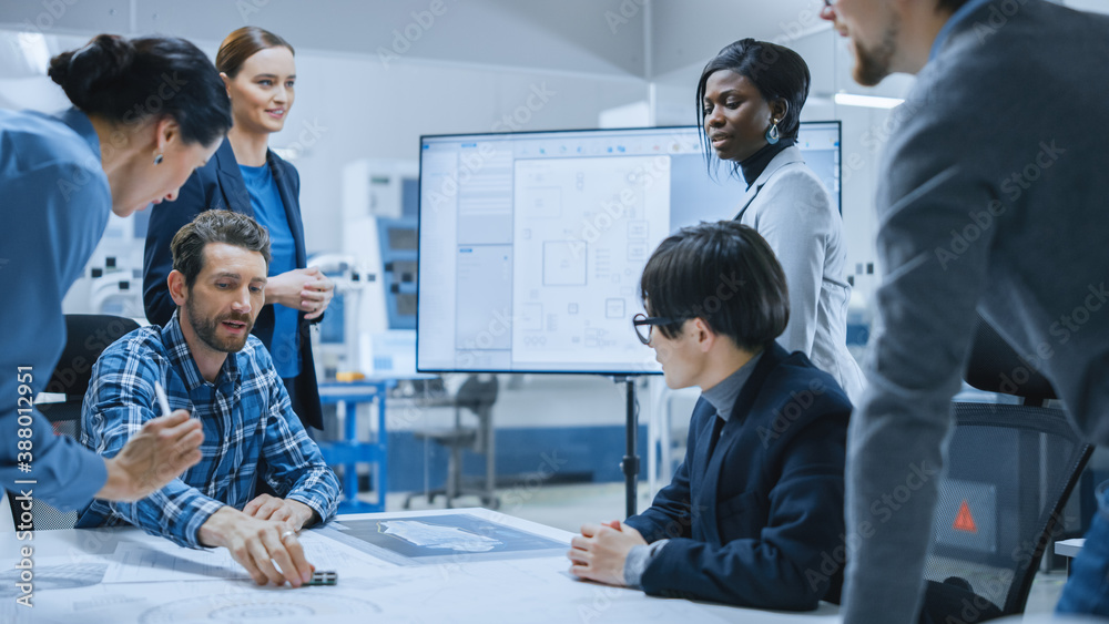 Busy Diverse Team of Computer Engineers and Specialists Gather Around Conference Table, They Discuss