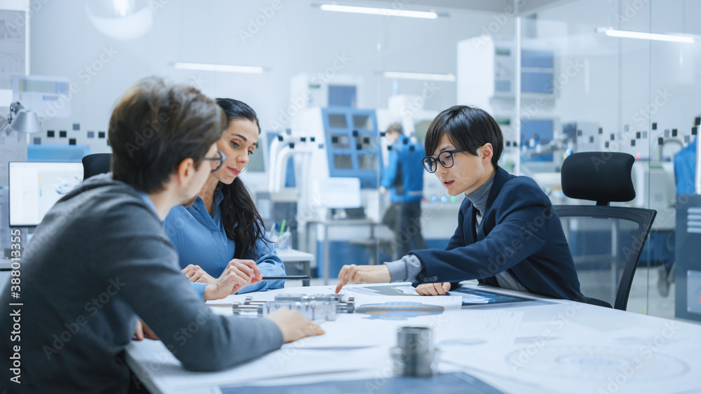 Diverse Team of Computer Engineers and Specialists Gather Around Conference Table, They Discuss Proj