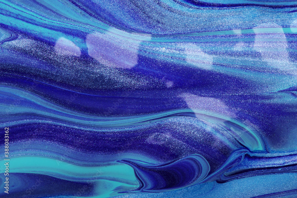 Close up photo of blue paint waves .