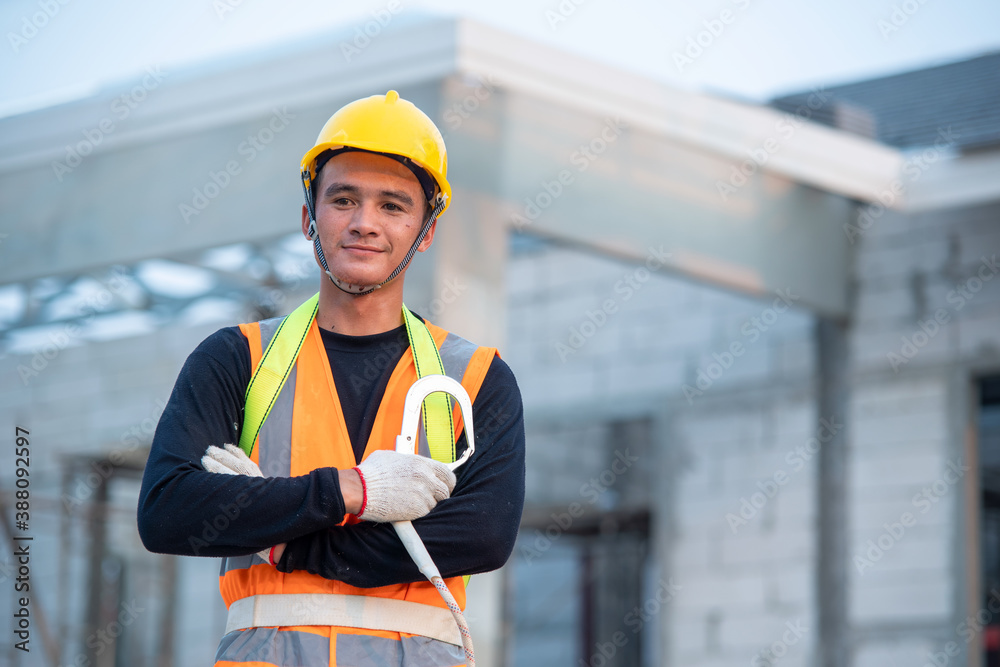 Construction worker working in the new house under construction.