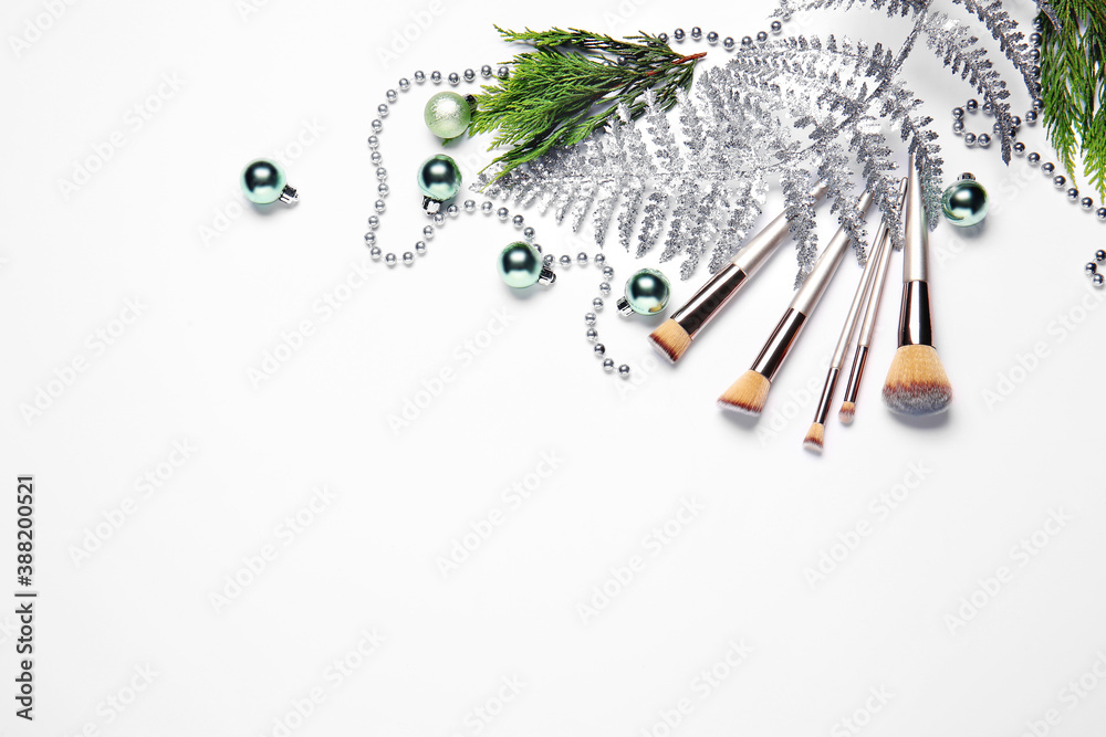 Christmas composition with cosmetics on white background