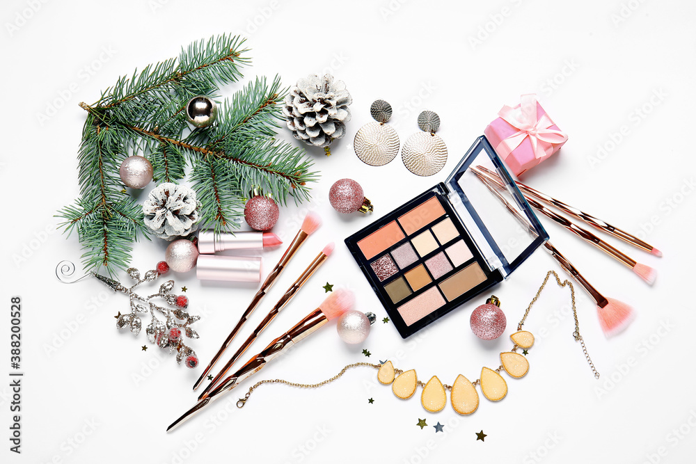 Christmas composition with cosmetics on white background