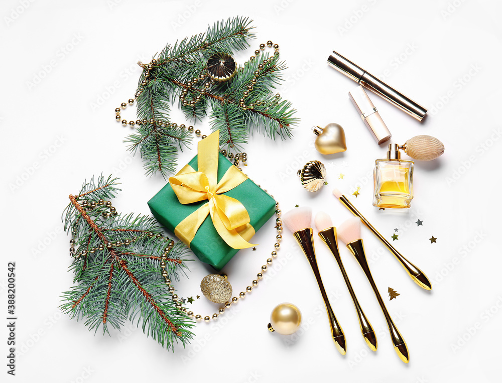 Christmas composition with cosmetics on white background