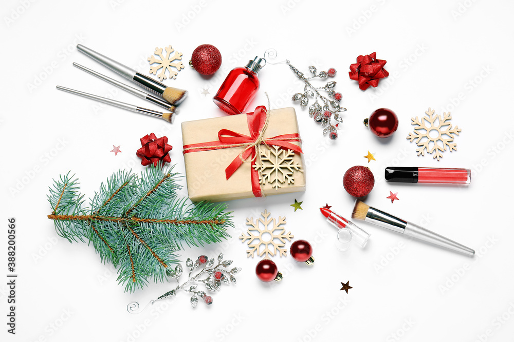 Christmas composition with cosmetics on white background