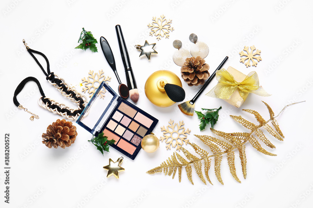 Christmas composition with cosmetics on white background