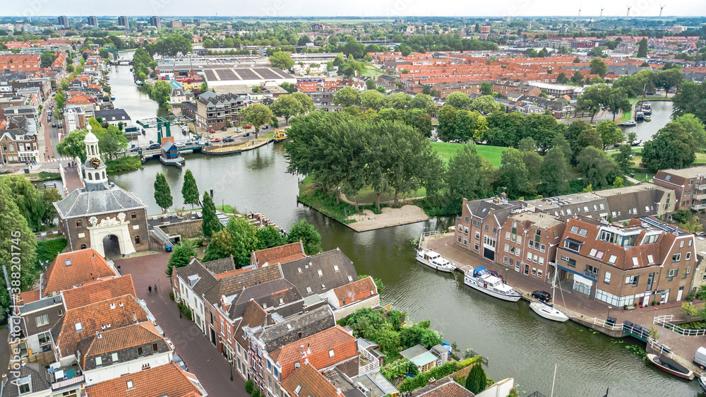 Aerial drone view of Leiden town cityscape from above, typical Dutch city skyline with canals and ho