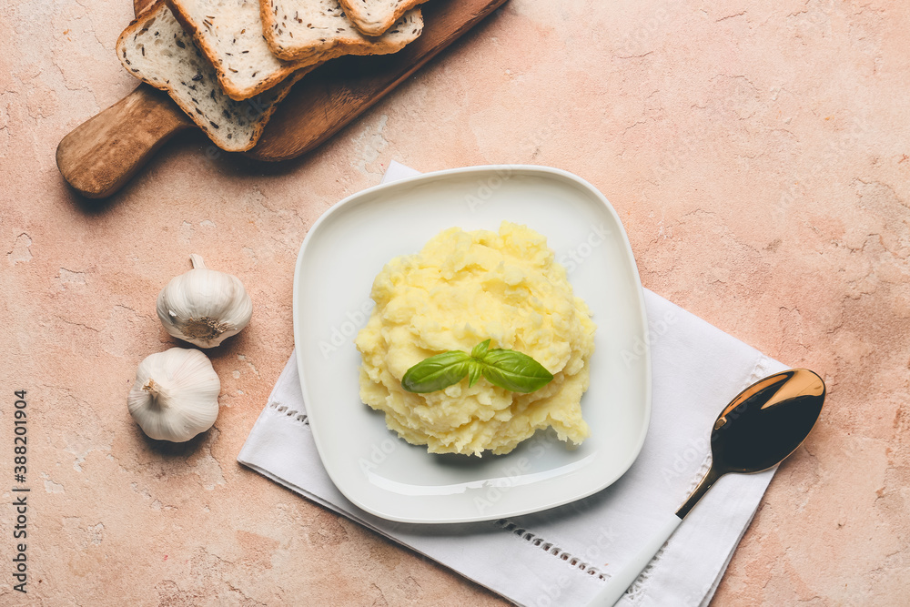 Composition with tasty mashed potato and garlic on table