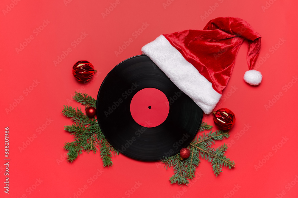 Vinyl disk and Christmas decor on color background