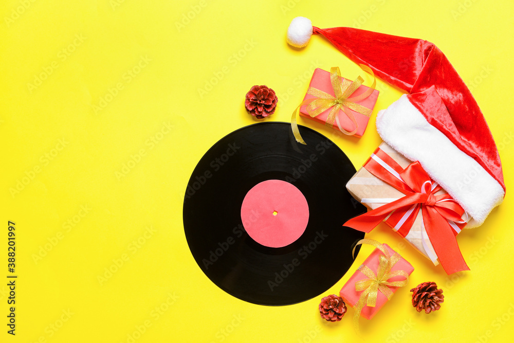 Vinyl disk and Christmas decor on color background