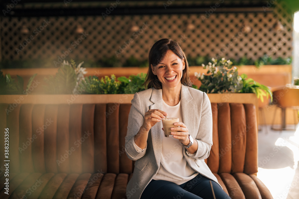 Natural beauty woman, casually dressed, at cafeteria.