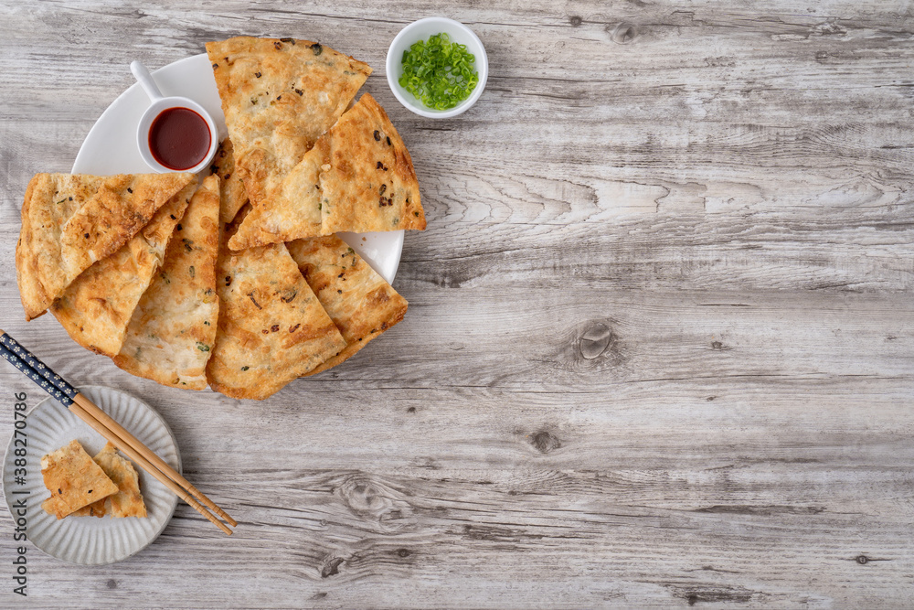 Taiwanese delicious scallion pancake over wooden table background