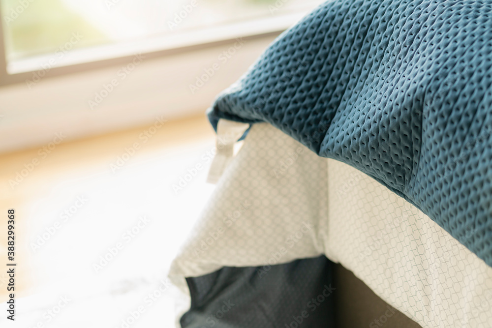 close up soft bed blanket and fur carpet rug near window bedroom