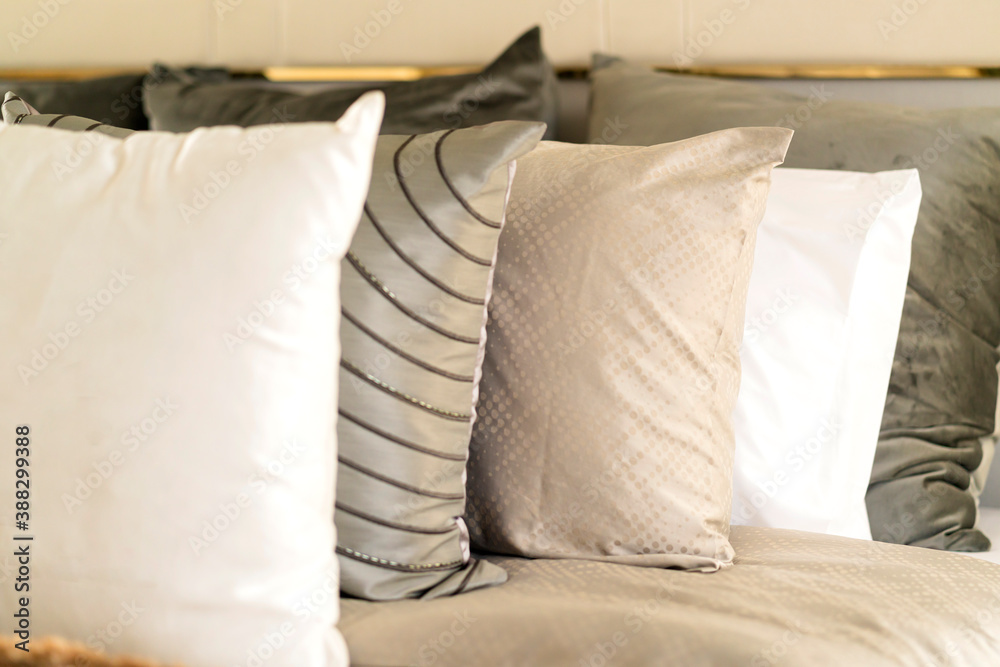 close up white beige soft pillows on bed and blanket bedroom interior design concept.bed maid luxury