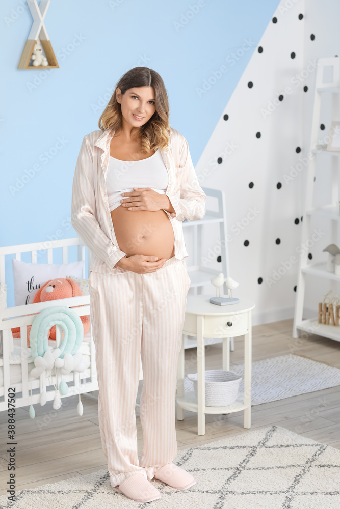 Beautiful pregnant woman at home