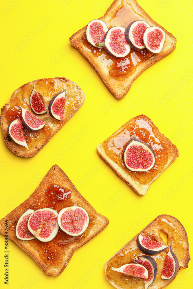 Tasty sandwiches with sweet fig jam on color background