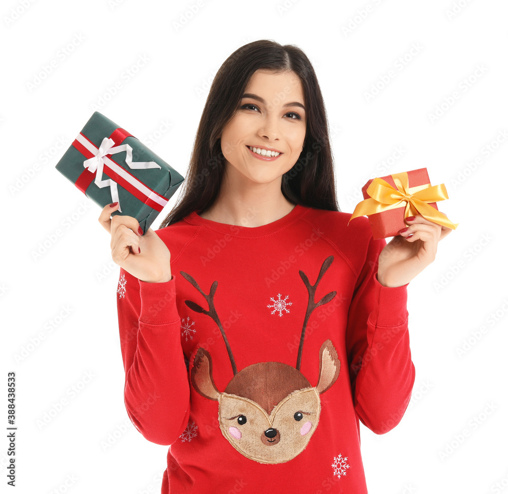 Beautiful young woman with Christmas gifts on white background