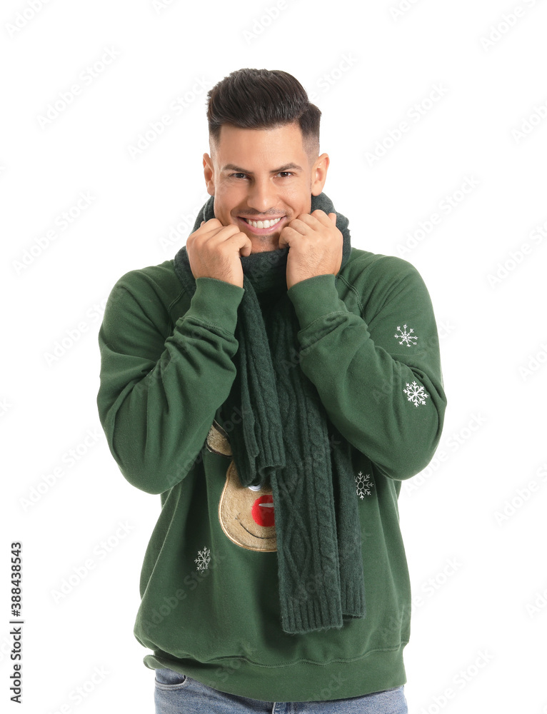 Handsome young man in winter clothes on white background