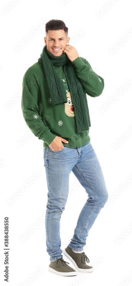 Handsome young man in winter clothes on white background