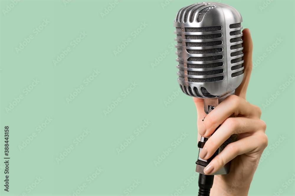 Retro style classic microphone on background