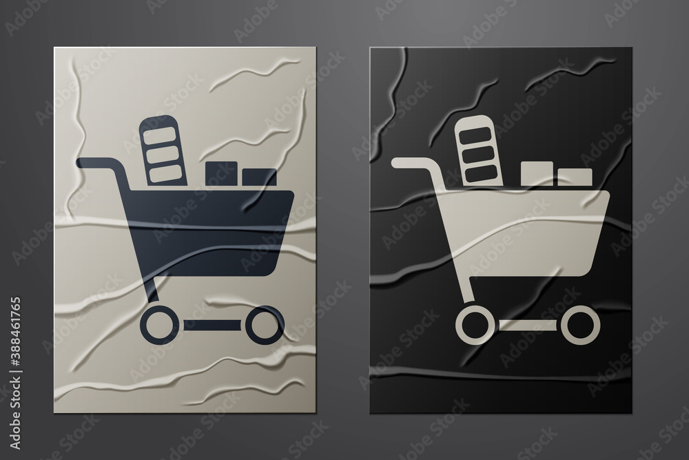 White Shopping cart and food icon isolated on crumpled paper background. Food store, supermarket. Pa