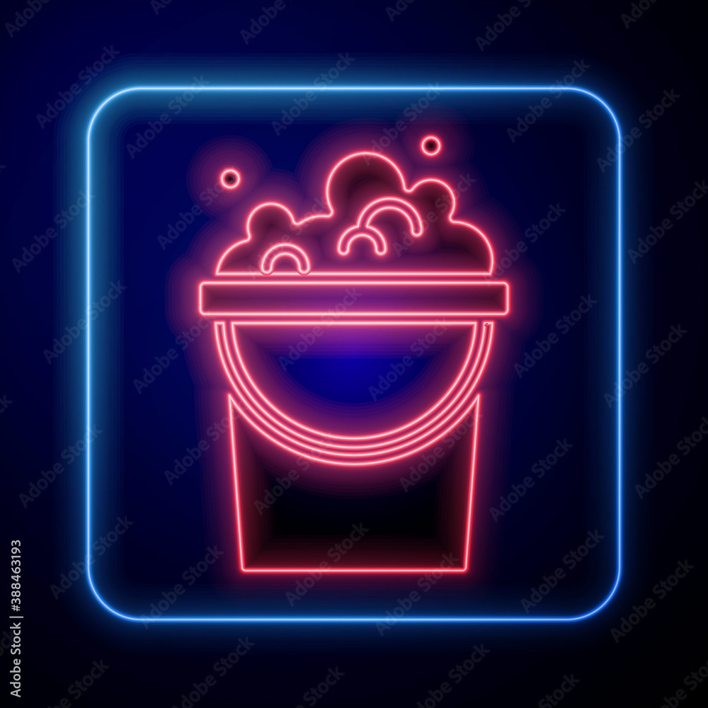 Glowing neon Bucket with soap suds icon isolated on blue background. Bowl with water. Washing clothe