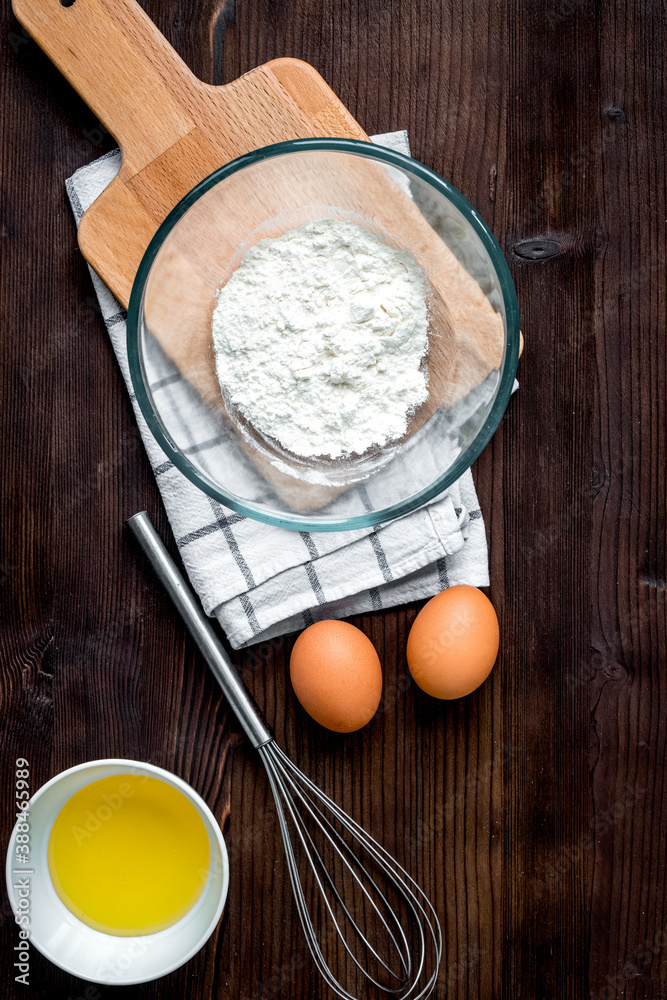 cooking pancake on wooden background top view ingredients for making