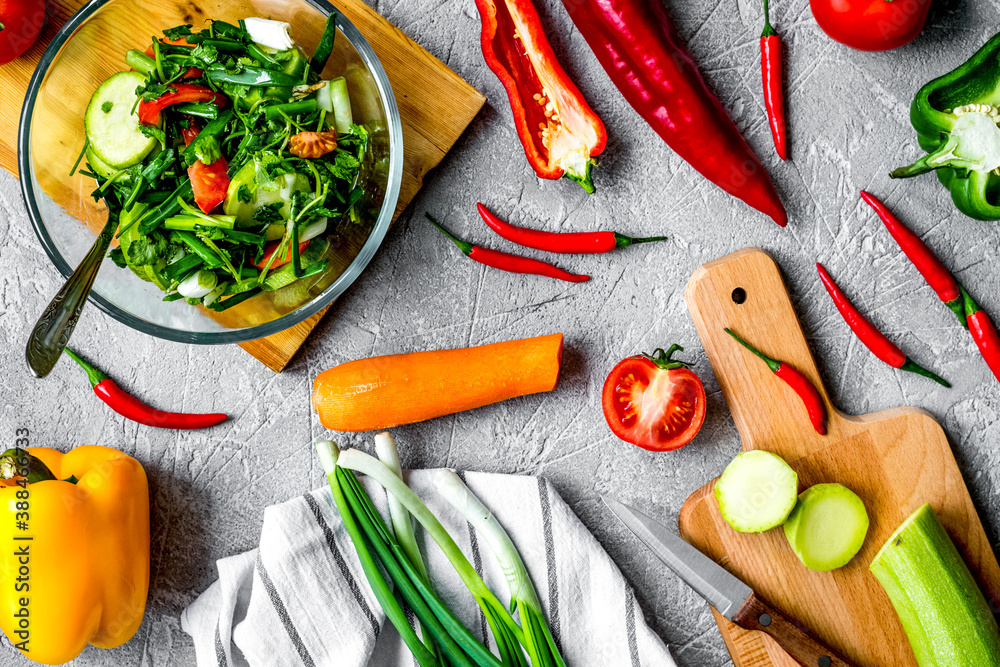 cooking vegetables on the stone background top view