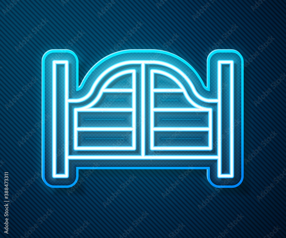 Glowing neon line Old western swinging saloon door icon isolated on blue background. Vector.