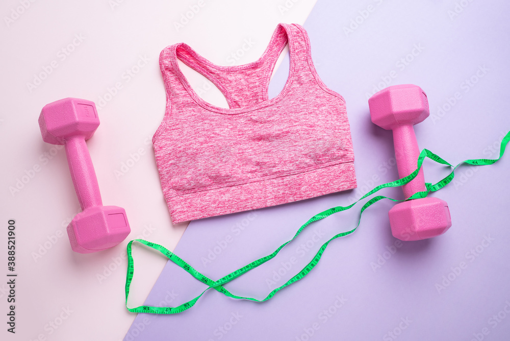 Female fitness vest and dumbbells