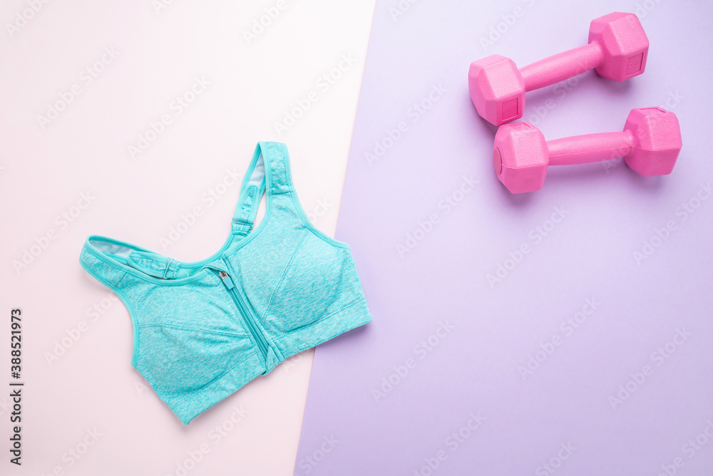 Female fitness vest and dumbbells